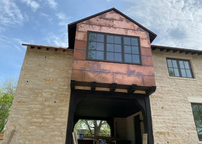 Copper metal panel facade on a stone building for Metal Roof Coating in Grosse Pointe Woods